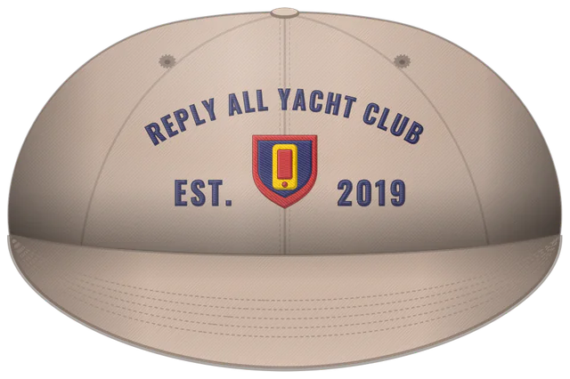 A stone dad hat embroidered with Reply All Yacht Club, Est. 2019 and a shield, made with The Club