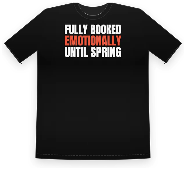 A black tee printed with Fully booked, emotionally, until spring in tall white and red letters, made with Shirt Says